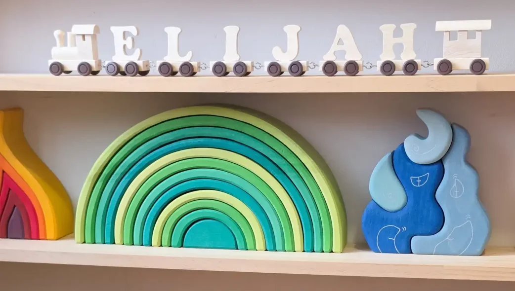 Elijah Wooden Name Train Displayed on Bedroom Shelf